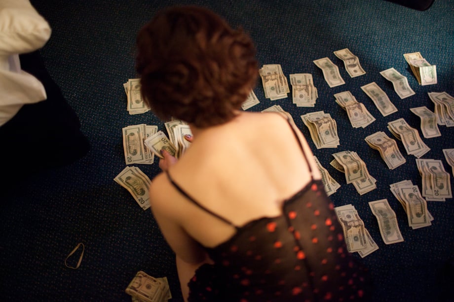Eden counting money by Alicia Vera
