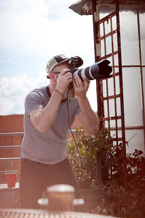 Image of Gregory Miller taking a picture. 