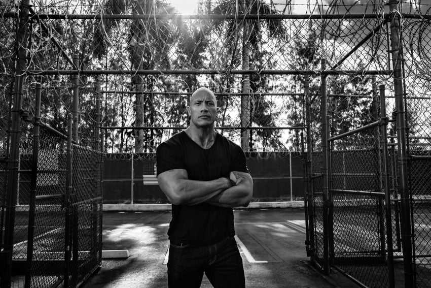 Craig Litten's black and white portrait of The Rock in front of a barbed wire fence for HBO