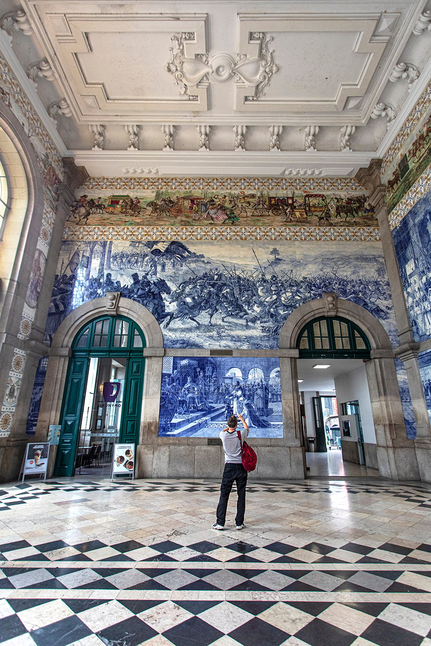 Cristina captures an image of an interior walls covered with blue historical paintings