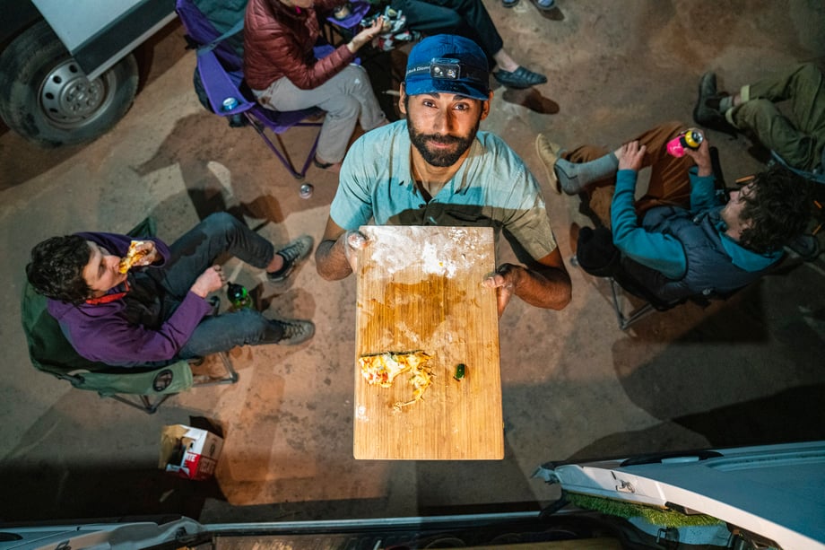 Dalton Johnson photographs leftover pizza during his adventures for Coalatree and Gregory Packs