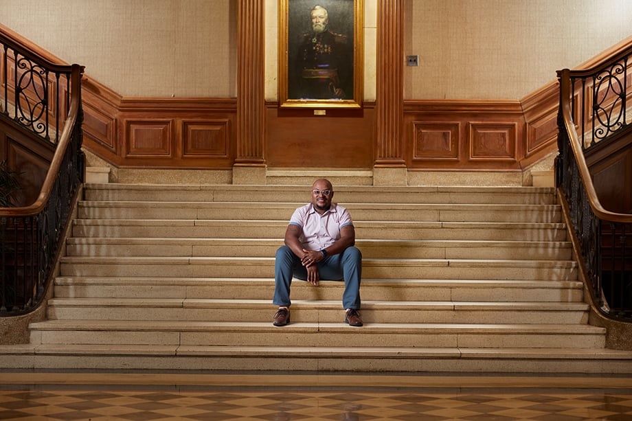 Dr. Curtis Cain on founders library staircase shot by Barry Harley