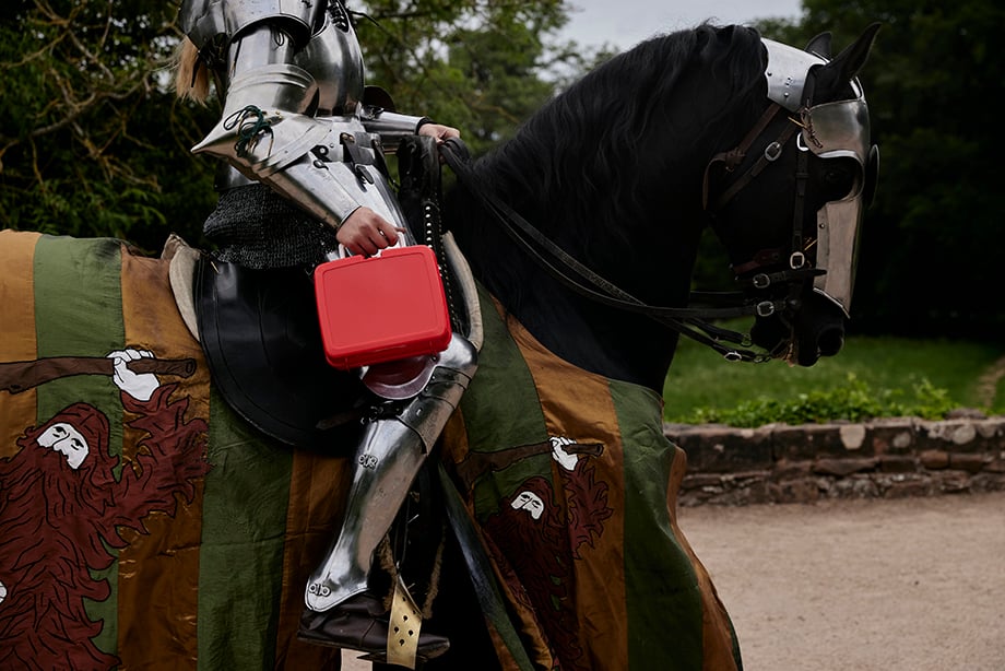 Reenactors lunchbox on medival armoured horse shot by Oliver Edwards