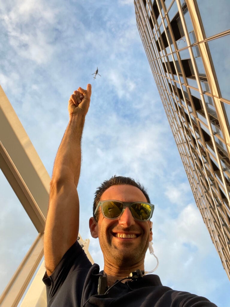 Craig Oppenheimer pointing toward the sky