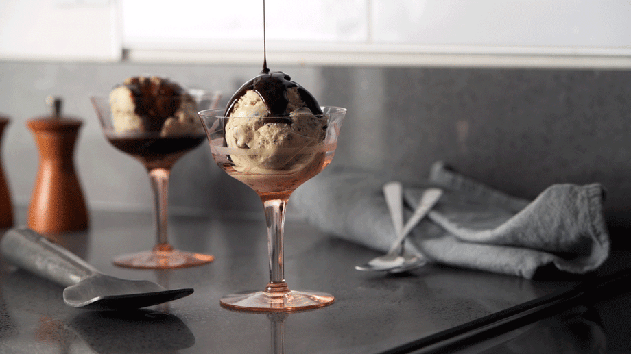 Shea Evans' photo of an ice cream sundae shown as a GIF, with chocolate syrup being poured over a scoop 