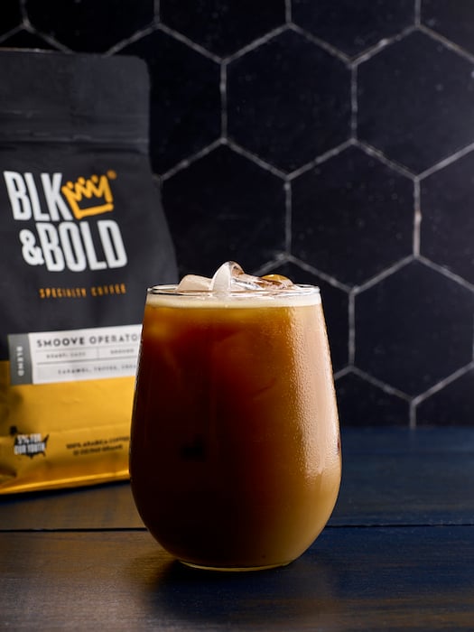 Iced coffee with BLK & Bold bag in background shot by Dhanraj Emanuel