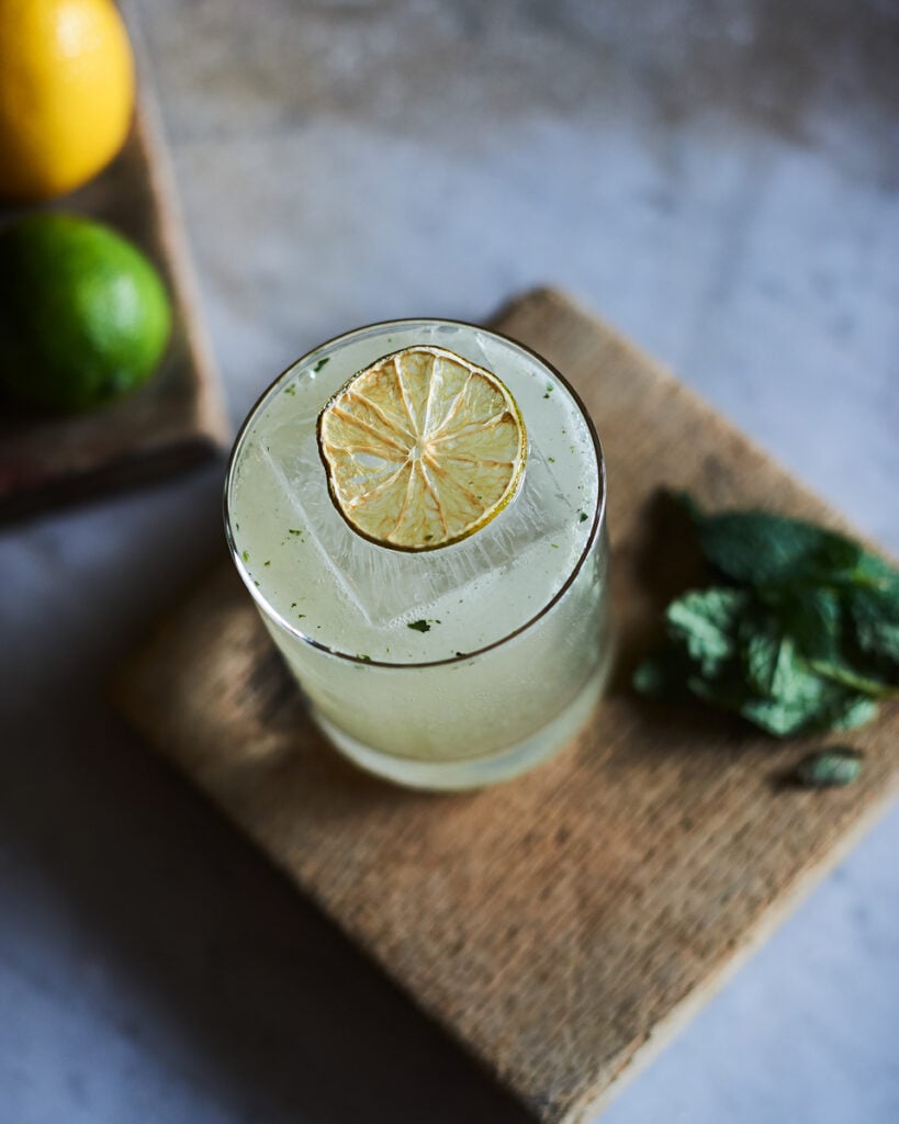 A margarita with a dried lime on top by John Cizmas, Los Angeles, California