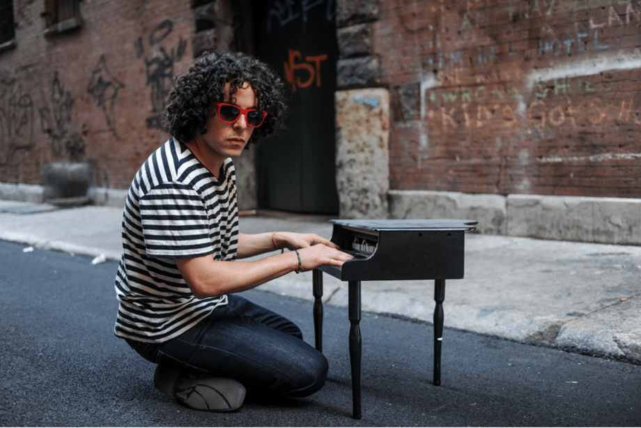 Man plays tiny piano on city street. Creative in Place Carry a Tune photographer Leah Overstreet, Atlanta, Georgia 