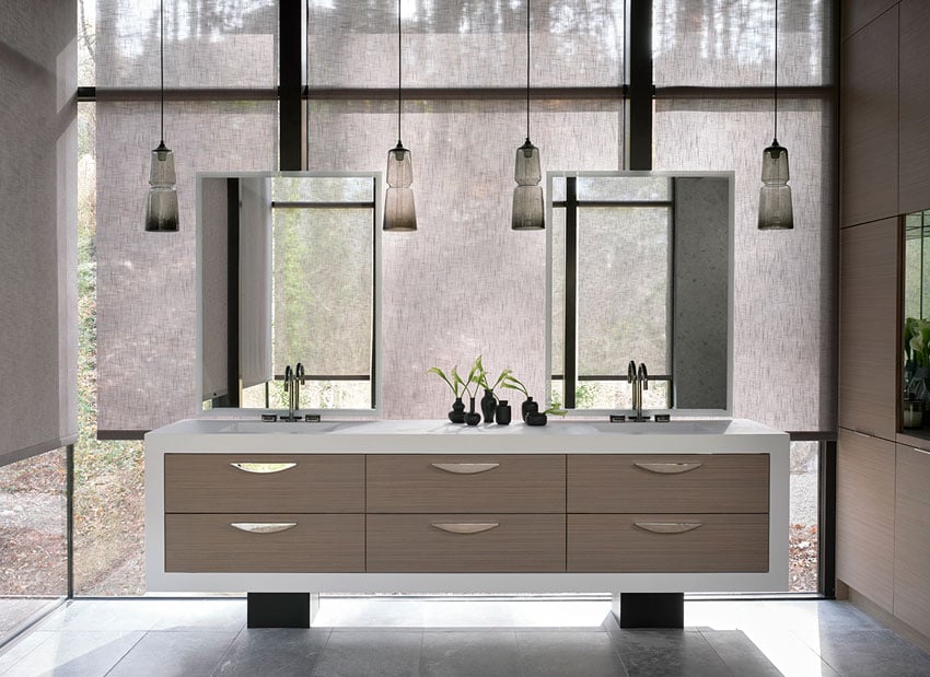 Mali Azima's photo for The Shade Store shows an image of a clean, modern vanity with motorized shades