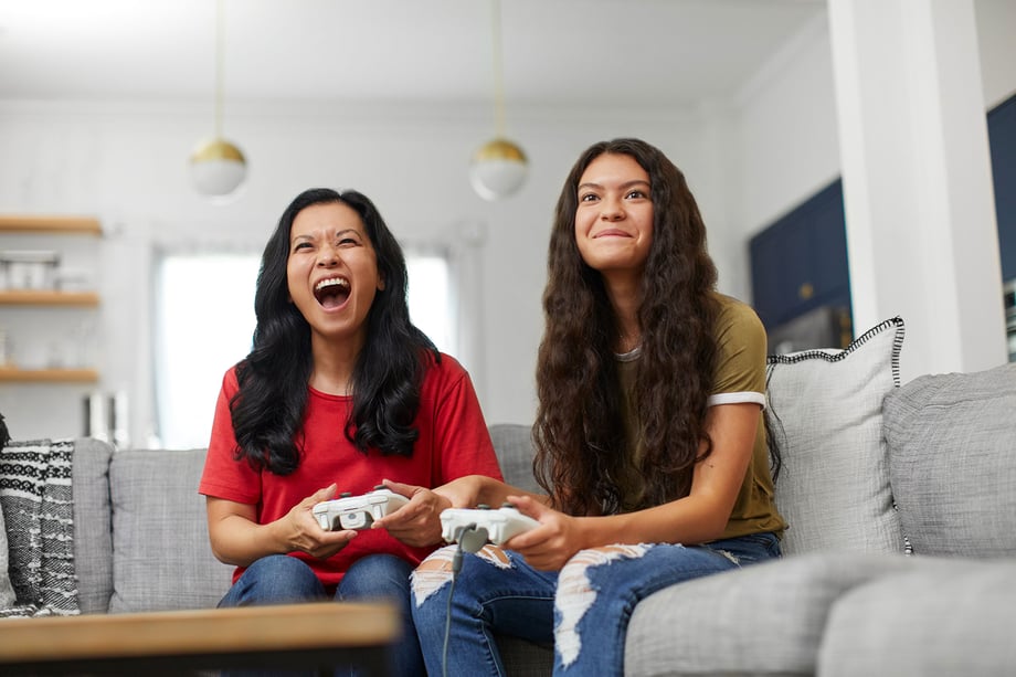 Natalia Weedy Calix two young women playing a console video game