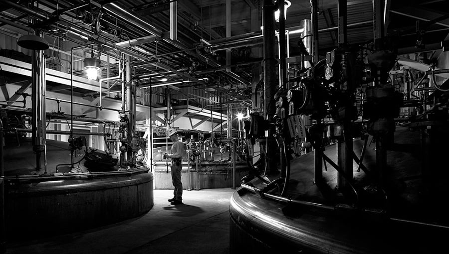 Shot of worker with machinery by Chicago Industrial photographer Peter Wynn Thompson