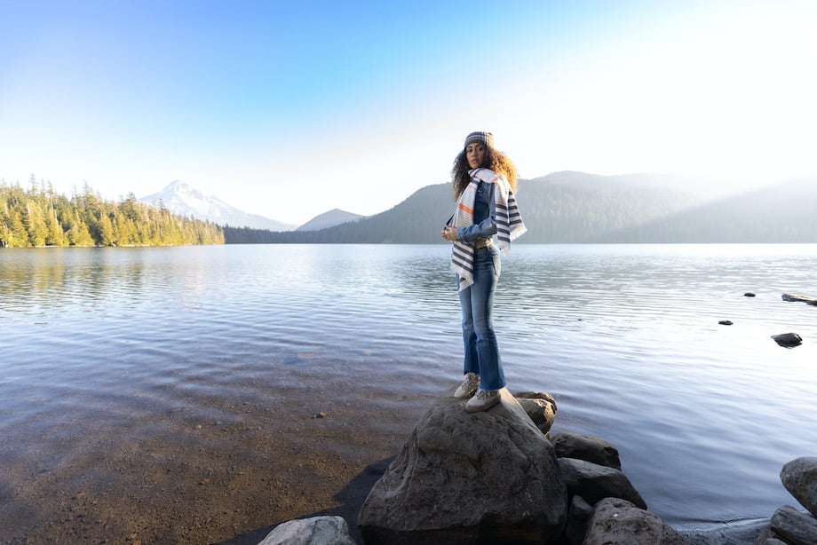 Model standing on rock in front of Lost Lake shot by Lance Koudele 