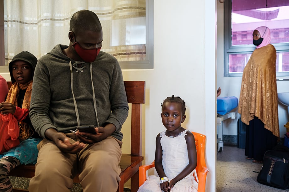 Little girl and father waiting for surgery shot by Roberto Morelli