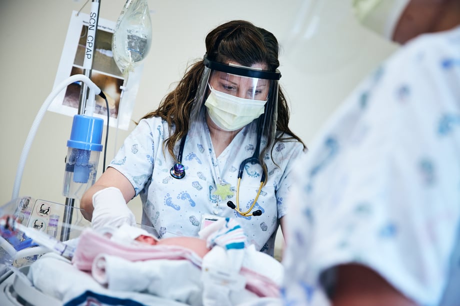 Ryan Smith captures a NICU nurse in PPE tending to a newborn at Meritus Medical Center during the COVID crisis