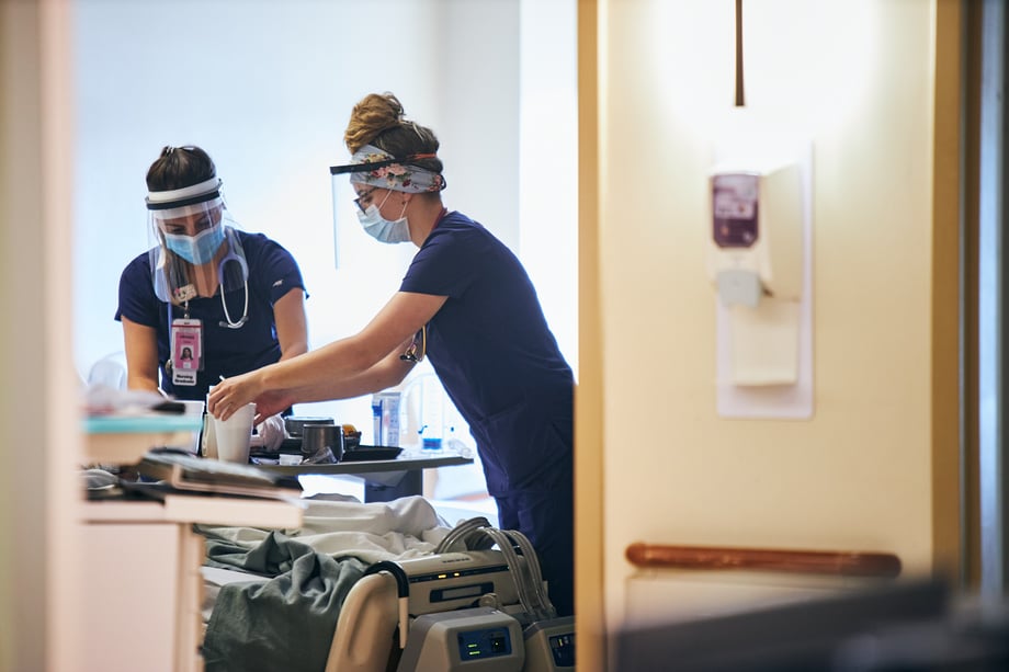 Ryan Smith captures nurses in surgical masks and face shields bedside at Meritus Medical Center 