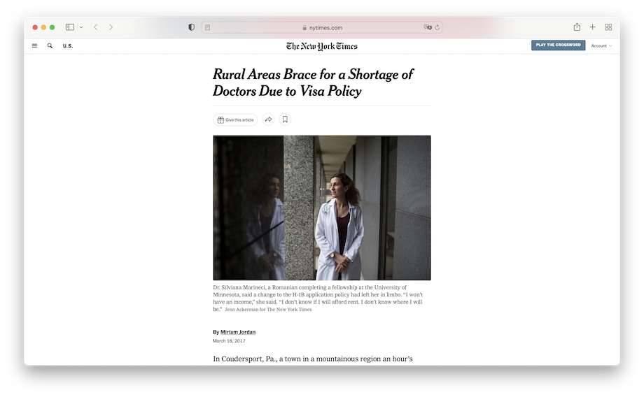 Screenshot of an article in the New York Times featuring a female doctor in a white lab coat standing in a narrow hallway.