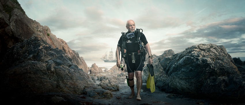Simon Plant's Compositing and Retouching of this photo shows a man in scuba gear in front of a ship