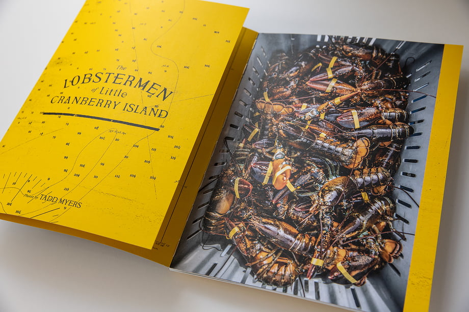 Tadd Myers released promotional booklet featuring the Lobstermen of Little Cranberry Island with photo of a basket of lobster their claws closed with little yellow bands