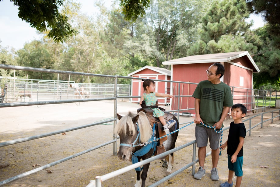 Tiffany Luong photographs children and husband riding ponies for Westways
