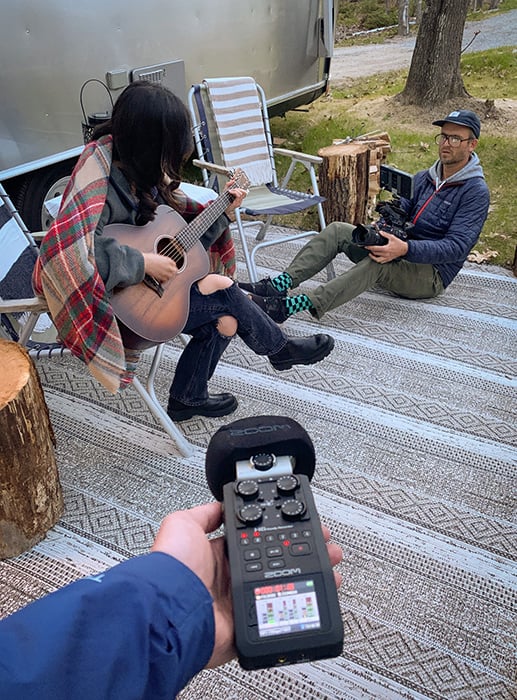 BTS of Trent Bell capturing video of  Willow Zhu playing guitar in Trent's back yard of Biddeford, Maine for Airstream music video.