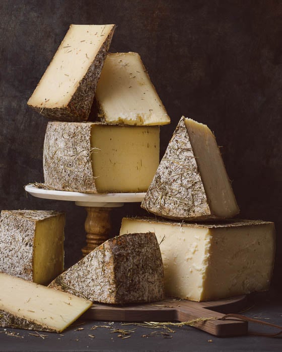 Photo of sliced blocks of cheese taken by Boston-based food photographer Adam DeTour. 