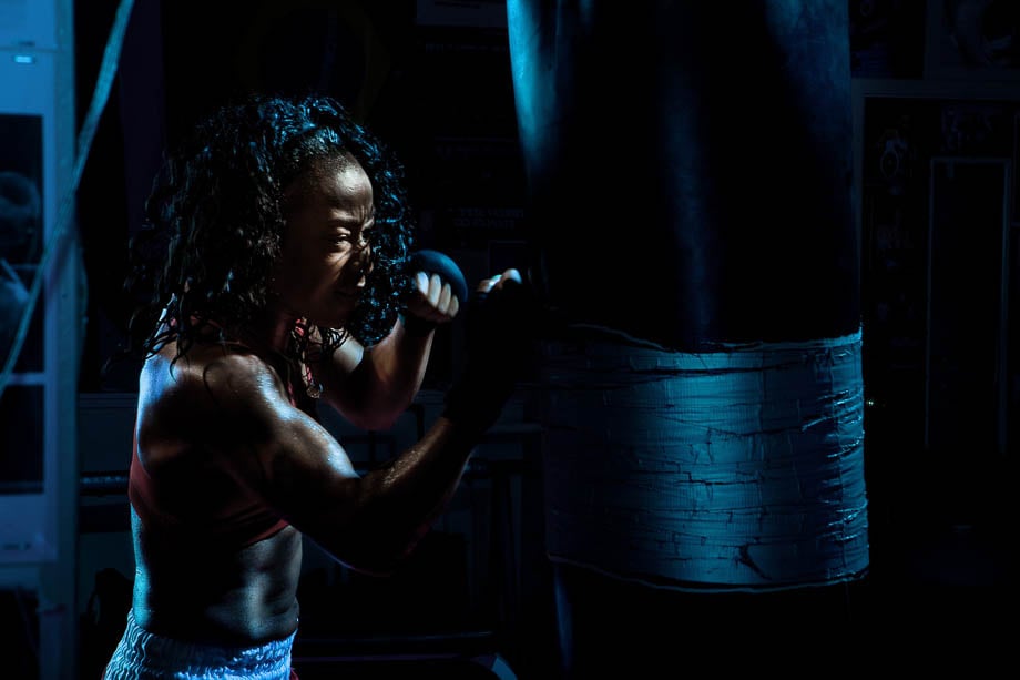 Photo of Raquel Miller boxing in the gym taken by San Francisco-based fitness photographer Alexis Cuarezma. 