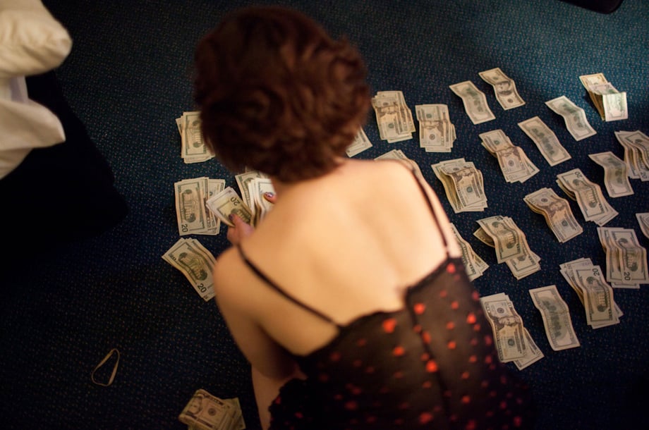 Alicia Vera shot of Eden counting money