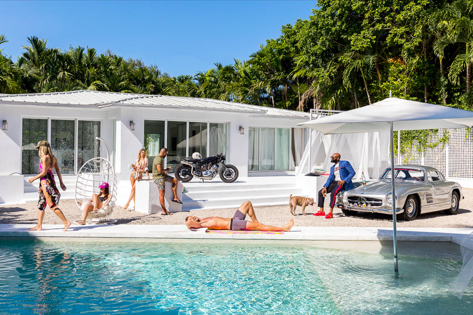 Photo of friends lounging beside a pool taken by Miami-based lifestyle photographer Amanda Julca. 