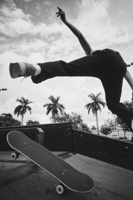 Black and white photo of a skateboarder suspended mid-air taken by Miami-based sports photographer Andrew Urban. 