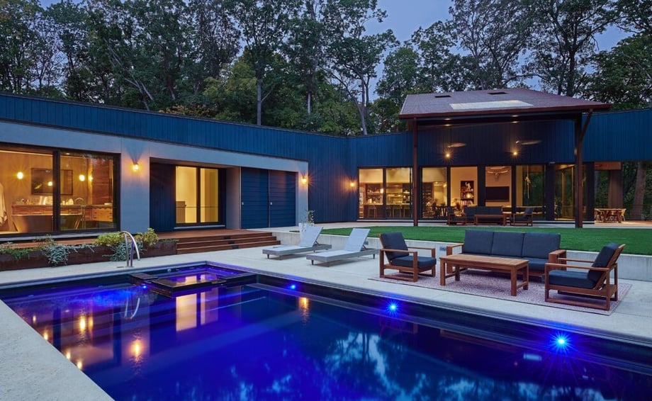 Exterior shot of a house and swimming pool by Anthony Tahlier.