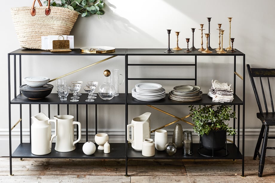 Photo of a stand containing plates, jugs, and other homeware taken by New York-based product photographer Bobbi Lin. 