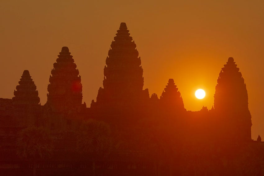 The sun sets over a silhouette of the temple in Bruce Martin's shot for Walking in the Shadow of Time 