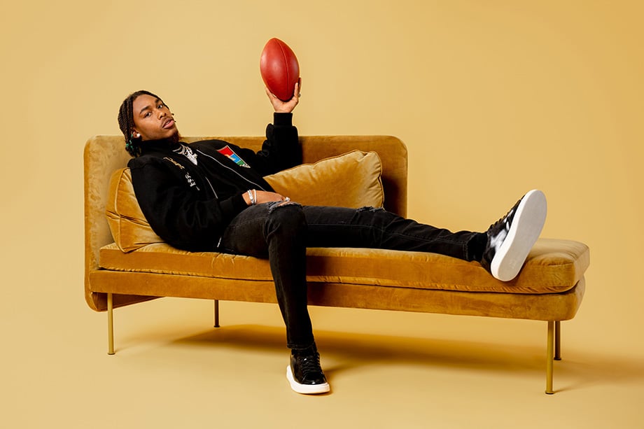 Justin Jefferson with football on sofa shot by Nate Ryan