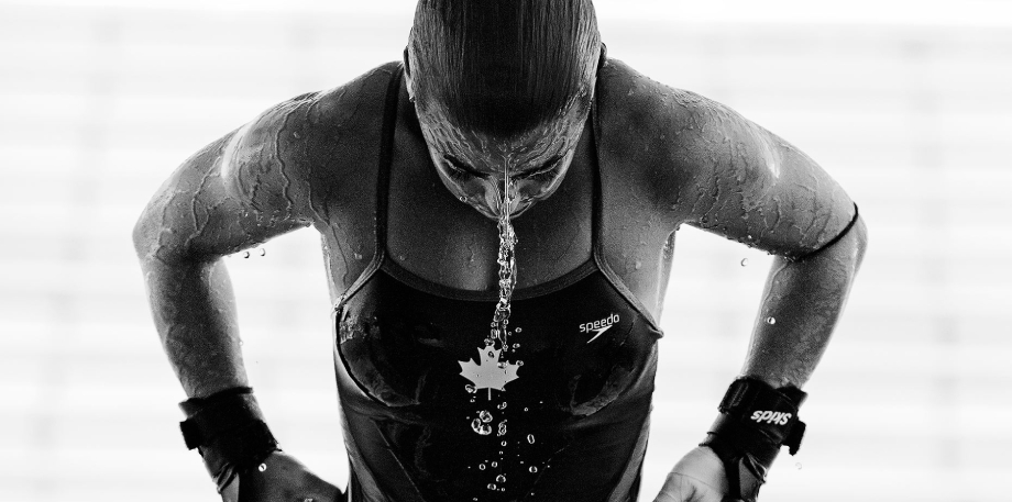 Photo of a female diver getting out of the water taken by Miami-based sports photographer George Kamper. 