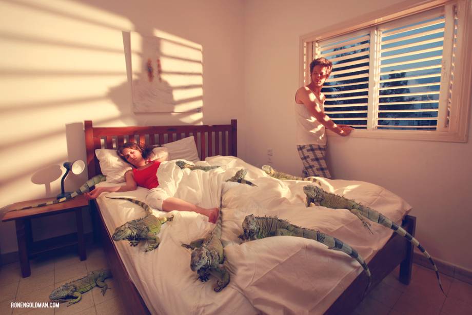 Woman in bed with iguanas shot by Tel Aviv, Israel-based conceptual photographer Ronen Goldman
