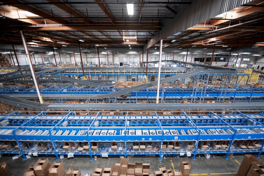 Photo of large blue conveyor system in warehouse, by San Diego-based industrial photographer Frank Rogozienski.