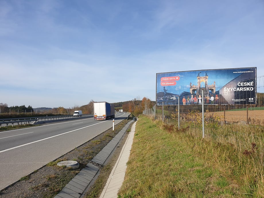 České Švýcarsko's We Miss People campaign billboard along a Czech Republic highway. 