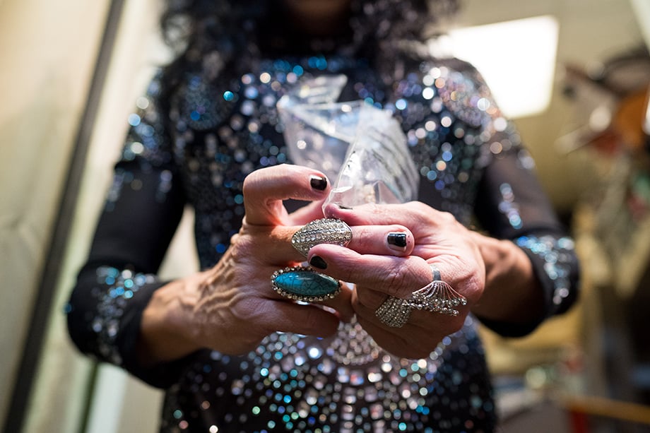 An editorial photograph taken by Justin Kase Conder showing Billy Warden's hands as he adjusts his rings for his debut as Debbie D. Lirious