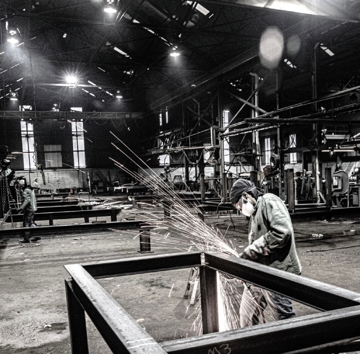Photo of a man doing some steelwork taken by Atlanta-based industrial photographer Kevin Garrett. 