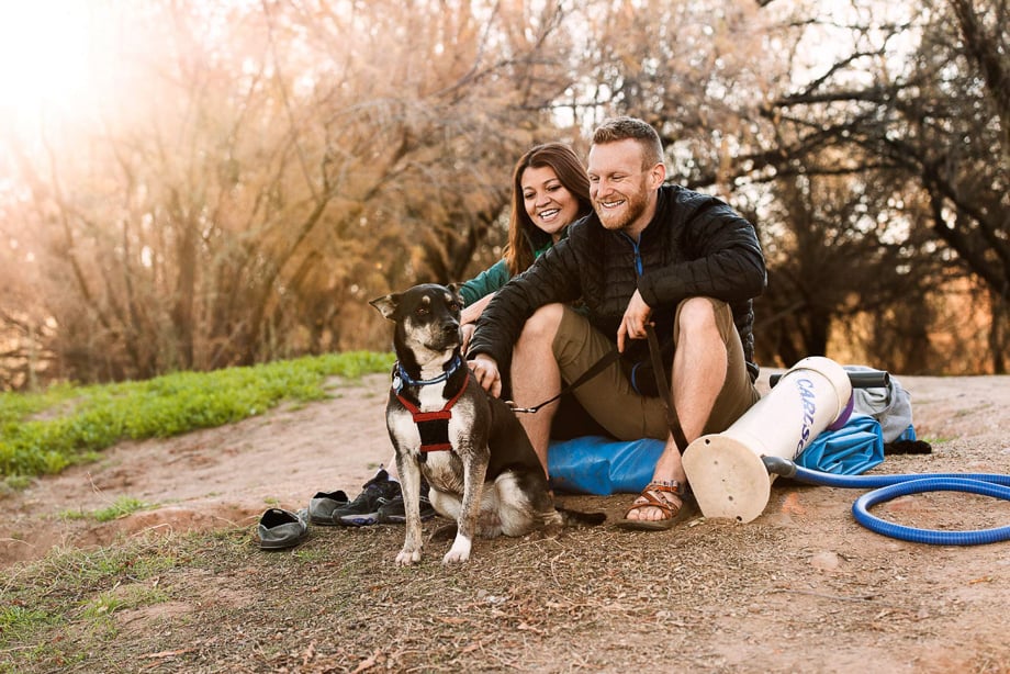 Photo of a couple with their dog, relaxing outside, taken by Atlanta-based lifestyle photographer Leah Overstreet. 