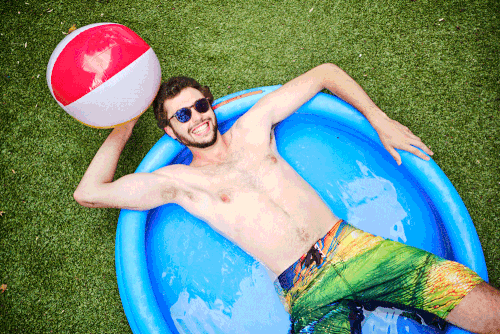 Gif of beachball player in in inflatable pool, by Los Angeles fitness photographer Marisa Guzmán-Aloia.