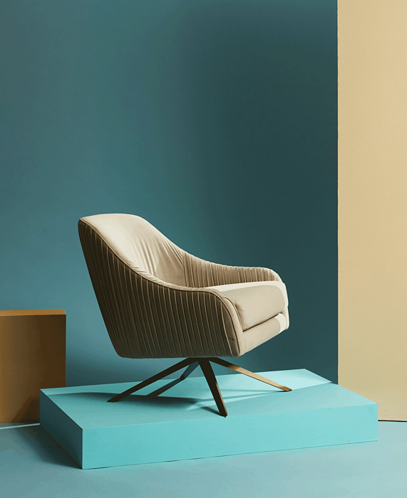 GIF of a rotating beige armchair taken by New York-based product photographer Mark Weinberg. 