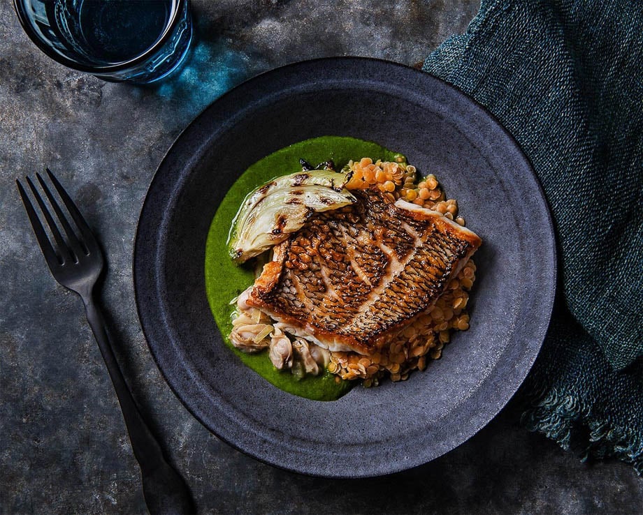Aerial photo of a grilled fish on a plate taken by New York-based food photographer Michael Marquand.