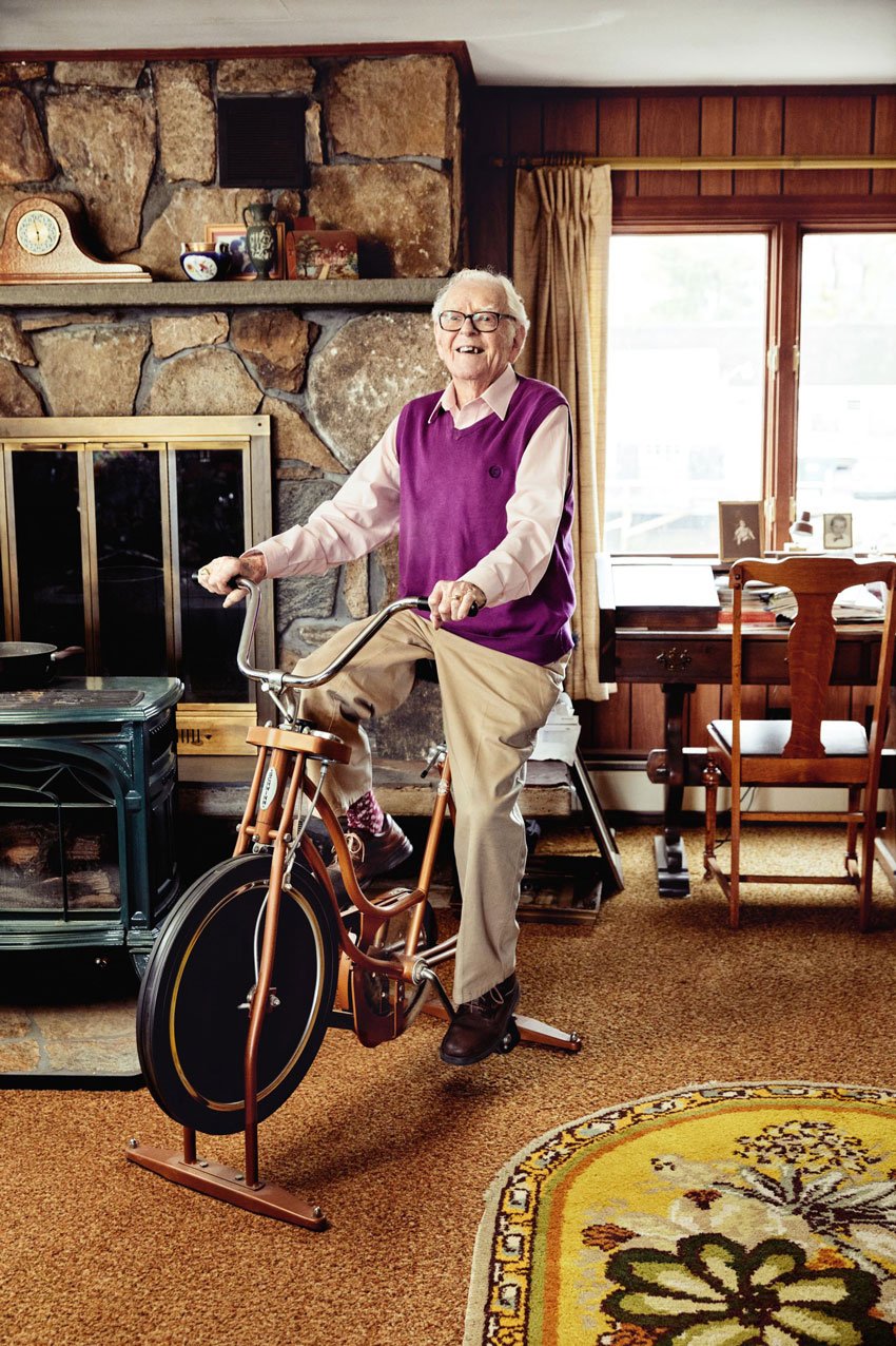 Michael Wilson captures a man in a purple sweater vest on a stationary bike for Down East Magazine 