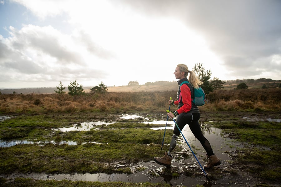 Image of hiker crossing wet field by London, United Kingdom-based photographer Pete Muller.