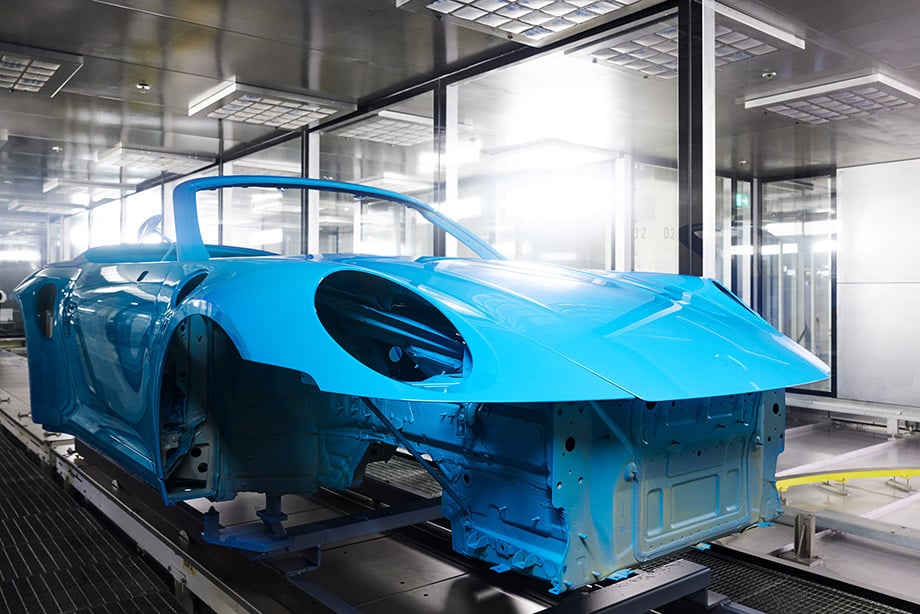 Photo of Porsche 911 during paint process at manufacture warehouse.