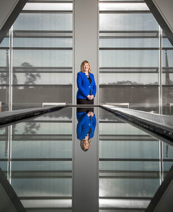 Portrait of a Sara Ortwein in a boardroom taken by Houston-based corporate photographer Robert Seale. 