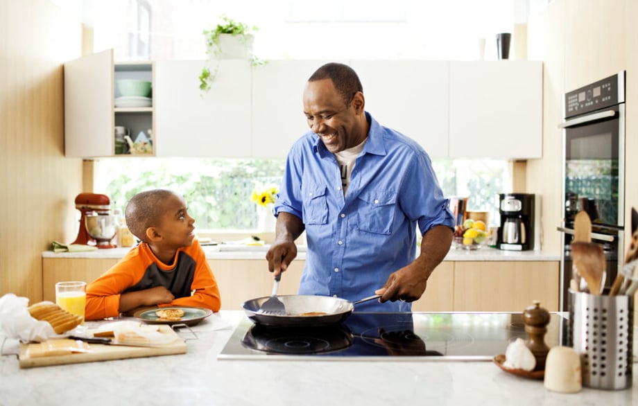 Photo of a father and son cooking in the kitchen taken by Washington DC-based lifestyle photographer Ryan Donnell. 