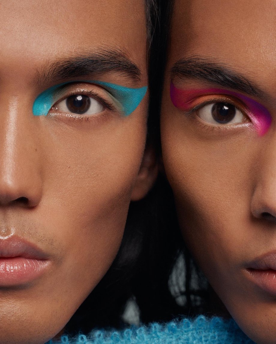 Photo by Saloni Agarwal of two models' faces side-by-side with striking neon eye makeup.