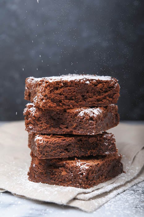 Photo of a stack of brownies with white power topping taken by Los Angeles-based food photographer Sedona Turbeville